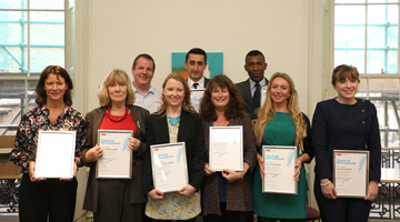 members together displaying their certificate qualifications.